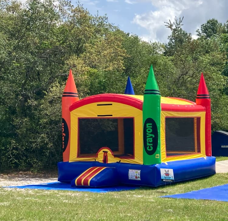 Crayon Craze Bounce House at a corporate event outside